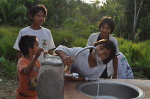 Children drinking clean H2O at the schoolhouse.