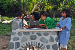 Children drinking clean H2O from school sink.