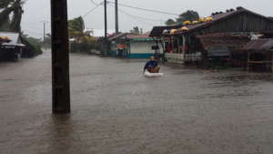 Paddling near the Maroa market after flood