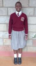 Wearing the new school uniform.