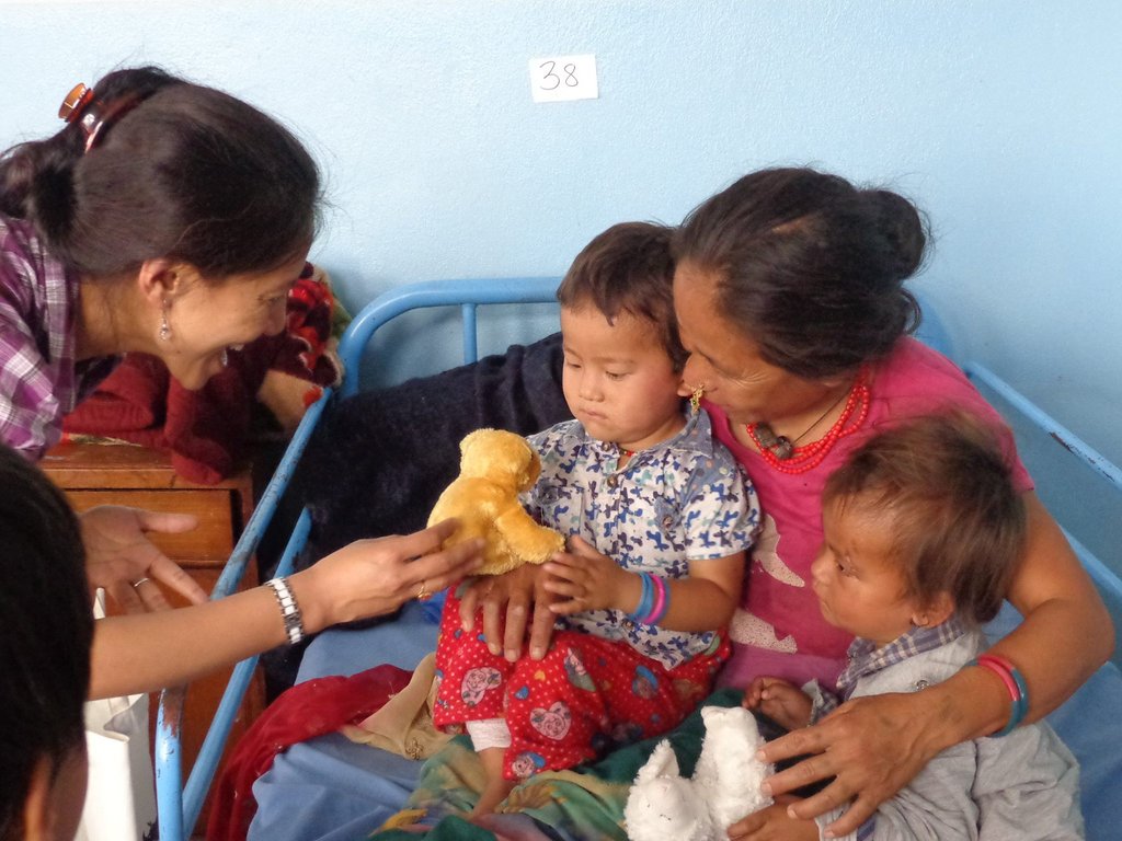 Counselor Chhori Laxmi Maharjan comforts family