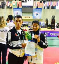 Bimala Receiving a Silver Medal in Para-Taekwondo