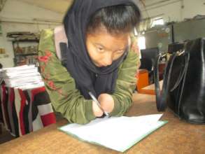 "Alisha" studying hard at school