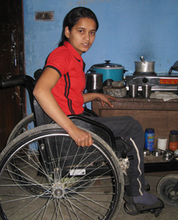 Laxmi in her wheelchair can go to school because of NYOF