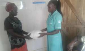 PREGNANT MOTHER RECIEVES A LLIN