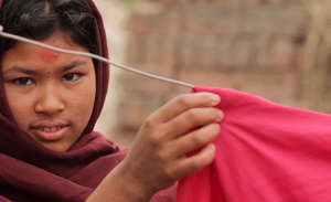 Girl hanging laundry