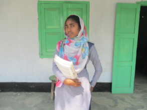 Rahima Standing at school varanda
