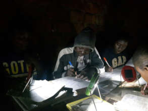 Students studying by solar light