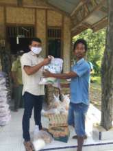 Panut distributing food parcels in Tangkahan