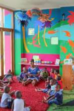 Story time on our big comfy rugs in Thanda ECD