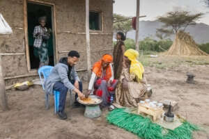 Etsay shares a meal with family