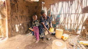 Halima prepares a meal for her children