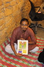 Noman proudly shows his first design