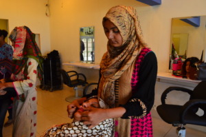Varisha practicing her beautician skills