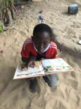 a young talibe being inspired to education at MDG