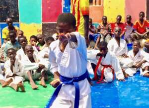 A karateka presenting his form at a tournament