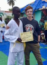 Sulayman receiving his yellow belt as a child