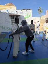 Issa Kouyate presents the newly earned belt