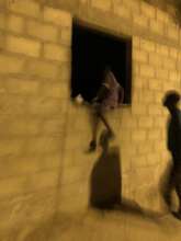 A talibe sneaking into his daara late at night