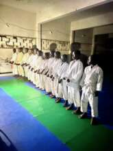 Young grading candidates in the dojo