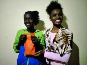 Beneficiaries pose with a set of pads in Aug 2021