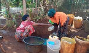 Community member collecting water