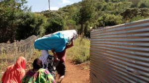 Our project staff delivering the mattress