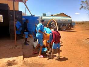 Students from the same school receiving water