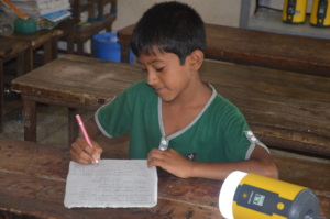 Students are studying with the help of Solar Lamp