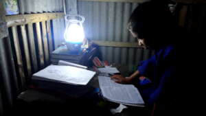 Students are reading with solar lamp