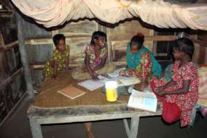 Students are studying with the help of Solar Lamp