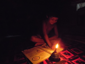 Poor students are studying with the help of lamp