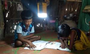 Students are continuing education using solar lamp