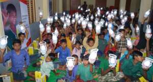 Children with distributed solar lamps