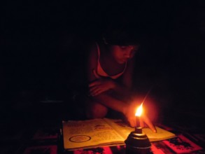 Still students read at night with kerosene lamp