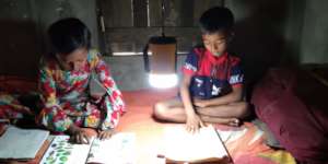 Students are reading with the help of solar light
