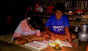 Poor students are studying with the help of lamp