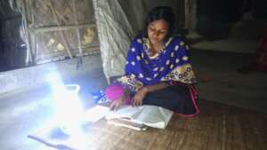 students reading with solar light