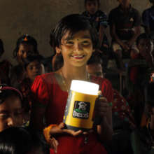 Students with solar lamp