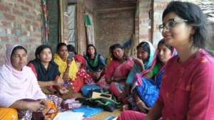 Visitors with Girls Group in Village