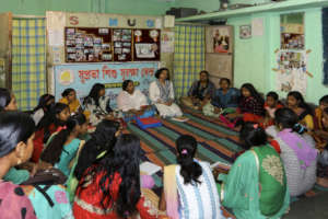 A Community Awareness session with Women and Girls