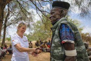 Our employee greeted by the chief of Nanam village