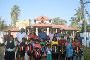Flood affected chidlren with school materials