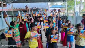 Kids expressing their joy after receiving books