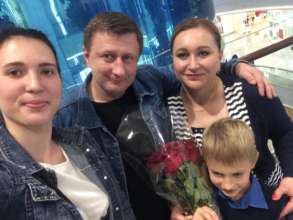 Vika (left), Elena and her husband and son Pavel