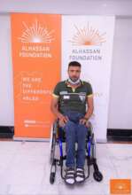 Hamada sitting on his new wheelchair