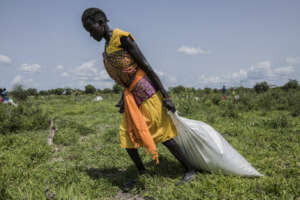 Walking home from World Vision's WFP distribution