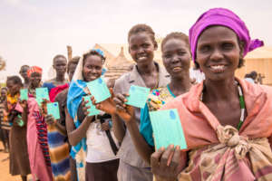 Happy smiles: Showing off their registration cards