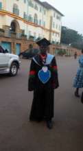 Joseph on his graduation gown