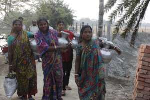 Local women are carrying water by the pitcher